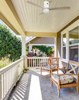 Elevate your outdoor living area with this damp-rated outdoor ceiling fan in light-wood with modern design and whisper-quiet airflow.