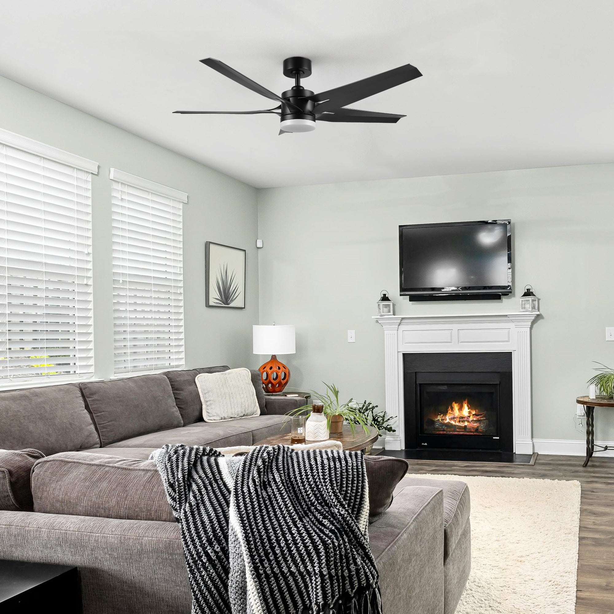 Araceli 52-inch DC ceiling fan with LED light and remote installed in a cozy living room setting, blending modern style with comfort.