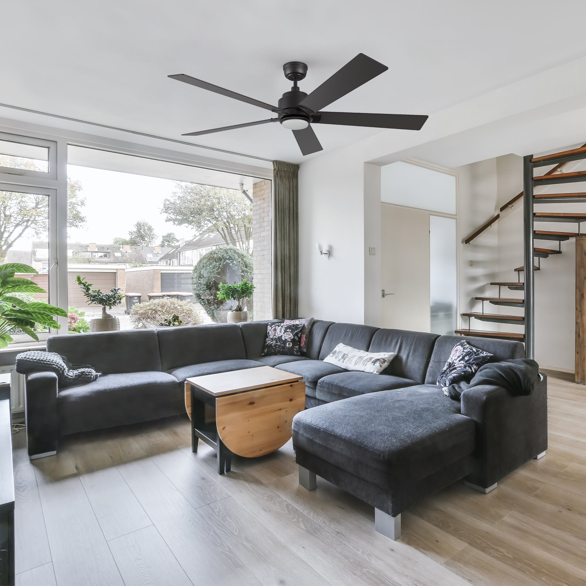 Spacious living room with the Aspen II smart ceiling fan in black, offering sleek design and enhanced air circulation for stylish interiors.