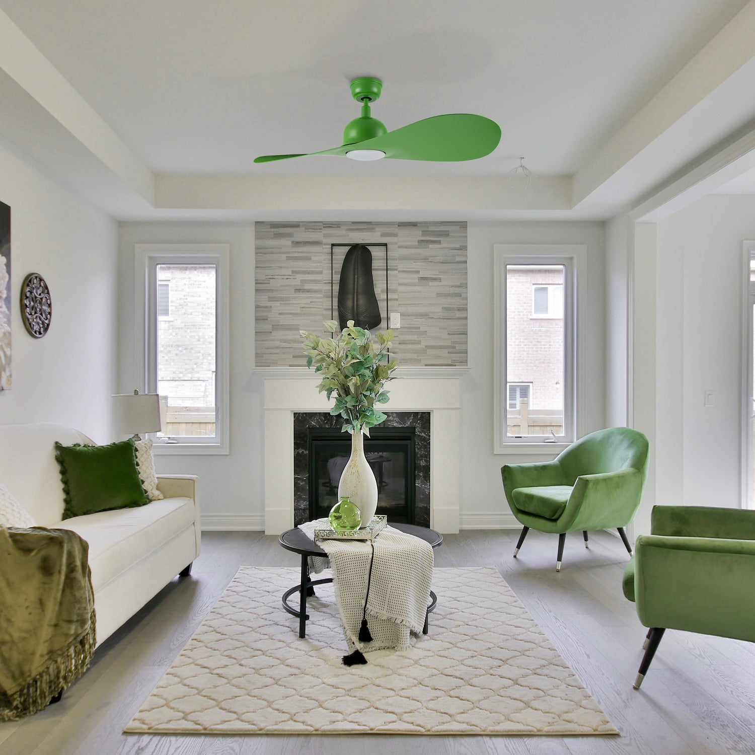 Azure modern smart ceiling fan with LED light and remote installed in a stylish green living room, offering energy efficiency and modern aesthetics.