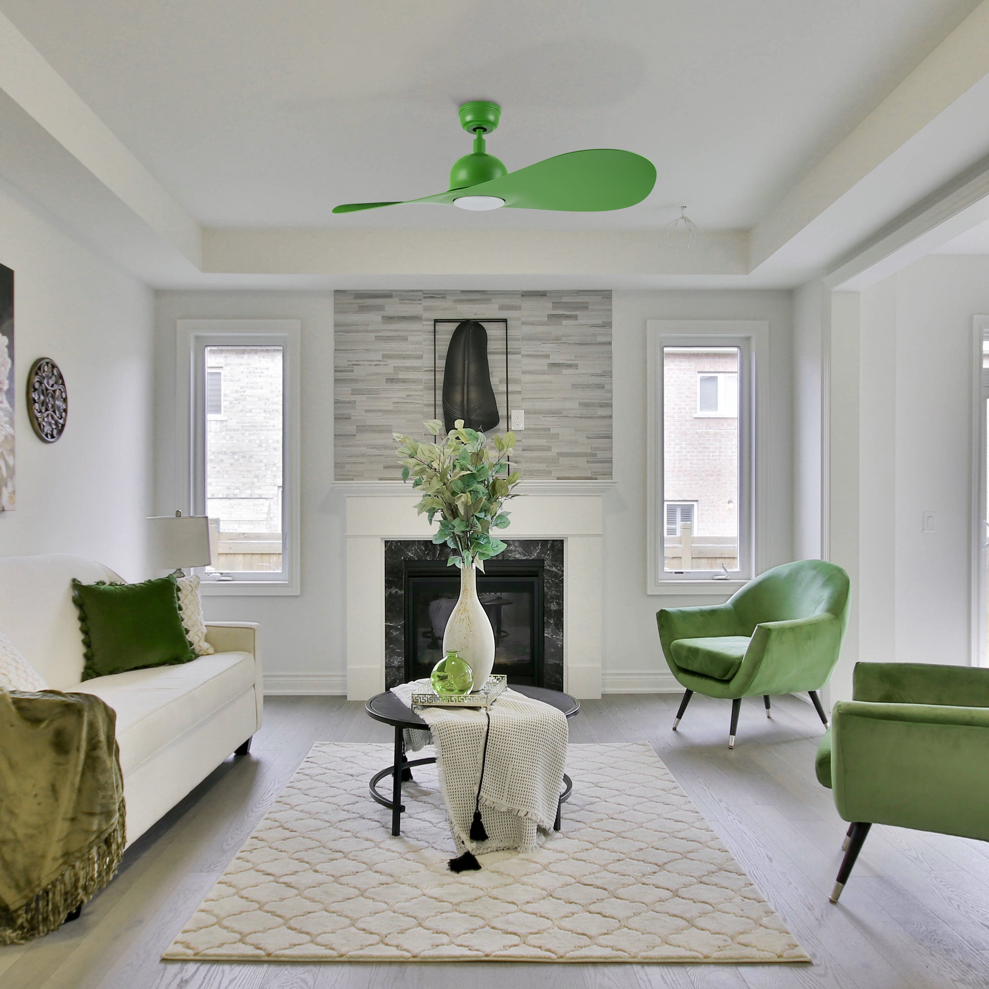 Azure modern smart ceiling fan with LED light and remote installed in a stylish green living room, offering energy efficiency and modern aesthetics.