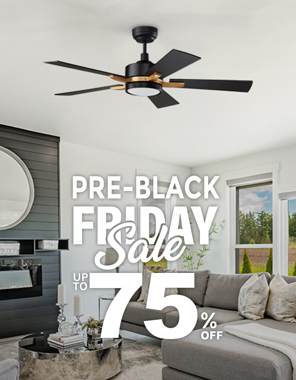 A modern, bright living room featuring Apex 52 inch black and gold smart ceiling fan with light. The room is decorated with a large, gray sectional sofa, a matching armchair, a round silver coffee table, and a rug. A black fireplace and a large round mirror are on one wall, while large windows offer a view of an open field. The image is overlaid with text promoting a "PRE-BLACK FRIDAY Sale" with "UP TO 75% OFF."