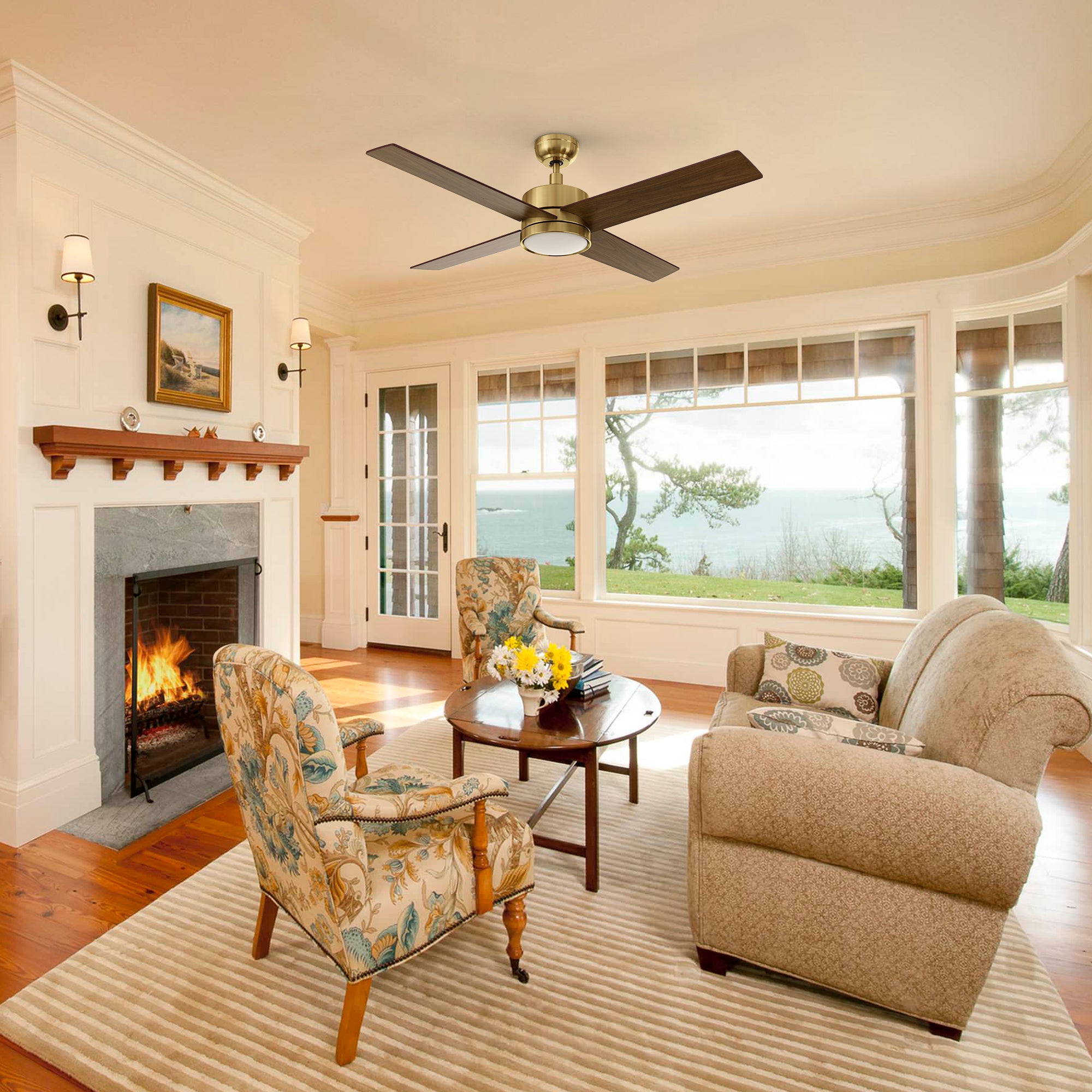 Traditional living room showcasing the Carro Smafan Rossendale 52-inch wood ceiling fan with LED light in a brushed gold finish.
