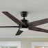 A modern 52-inch ceiling fan featuring five wood-finish blades and a sleek black motor housing, suspended from a black downrod. Designed for contemporary and industrial-style interiors.