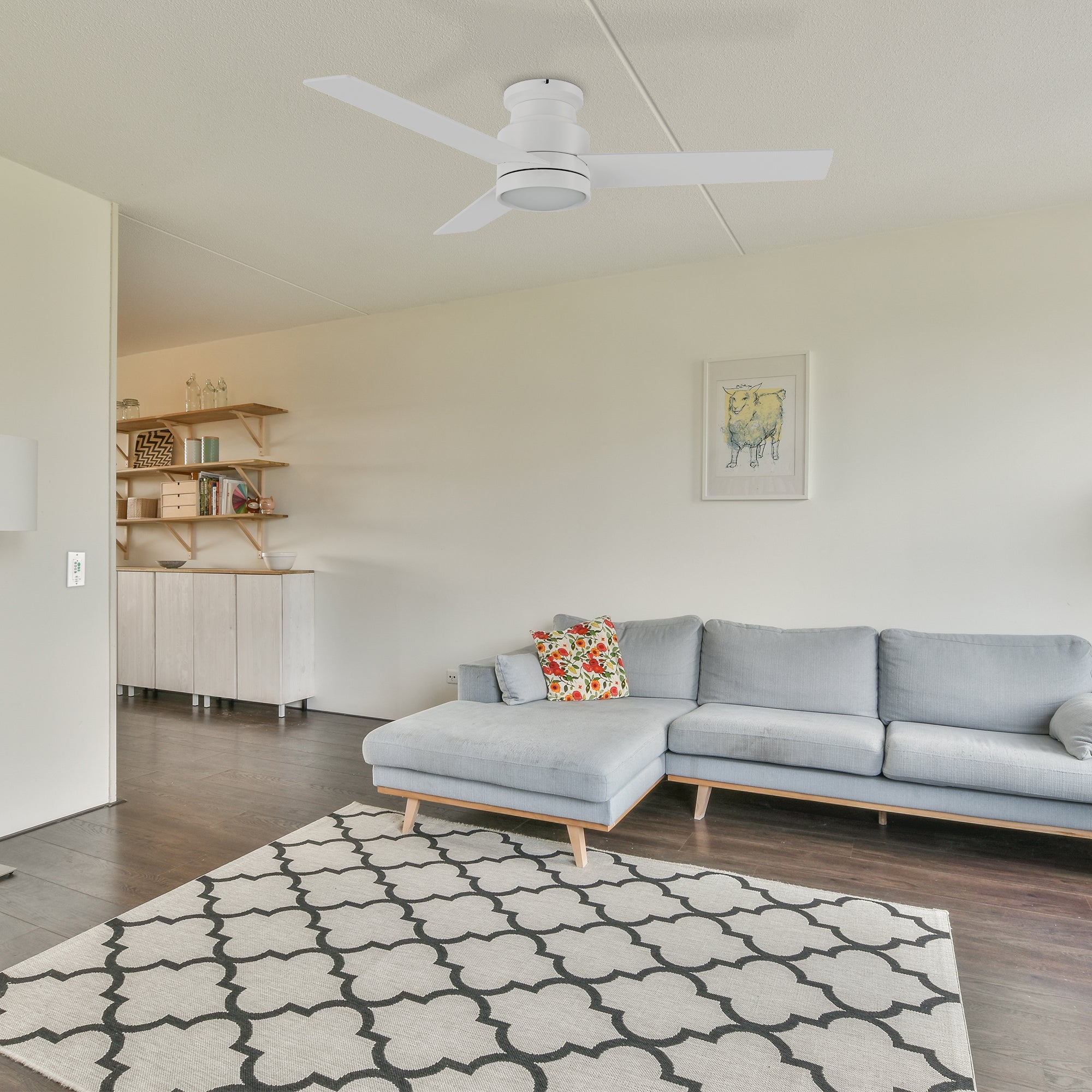 Low profile ceiling fan in white with LED light well matches to the gray and blue soft bag sofa and the white plum blossom pattern of the large carpet, making the whole living room with a modern sense.