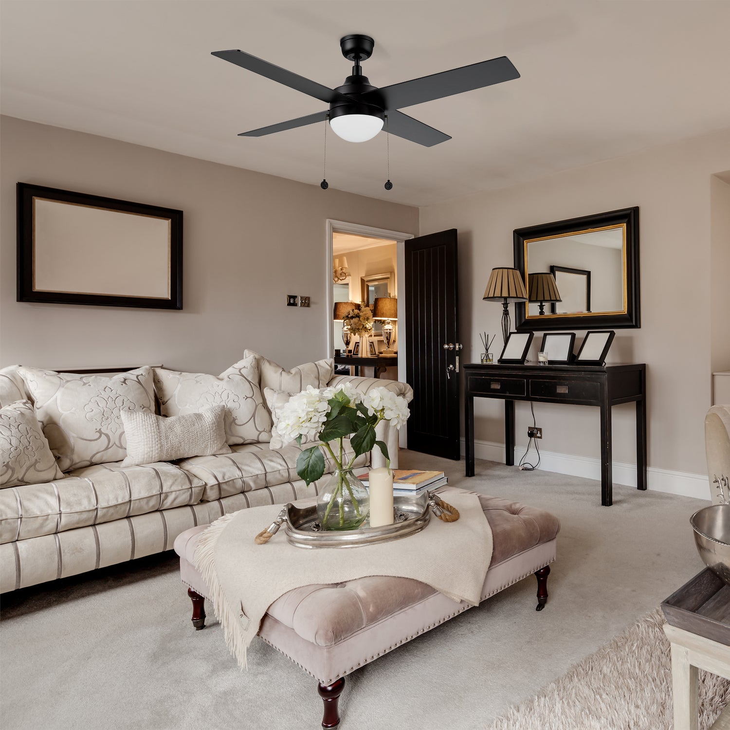 52-inch dowrnrod mount black ceiling fan with LED light, matching to white sofa, light brown short velvet coffee table, white hydrangea, retro wall mirror, make the whole living room very noble and elegant.
