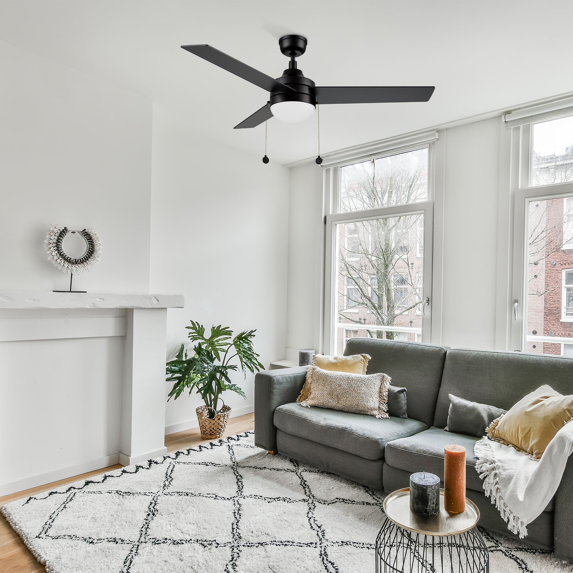 52 inch modern ceiling fan in black with light well matches the grey sofa in modern living room