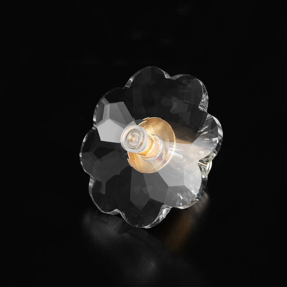 Flower shape light bulb made of premium faceted crystal with a gold finish center plate, displayed in a front-facing product shot.