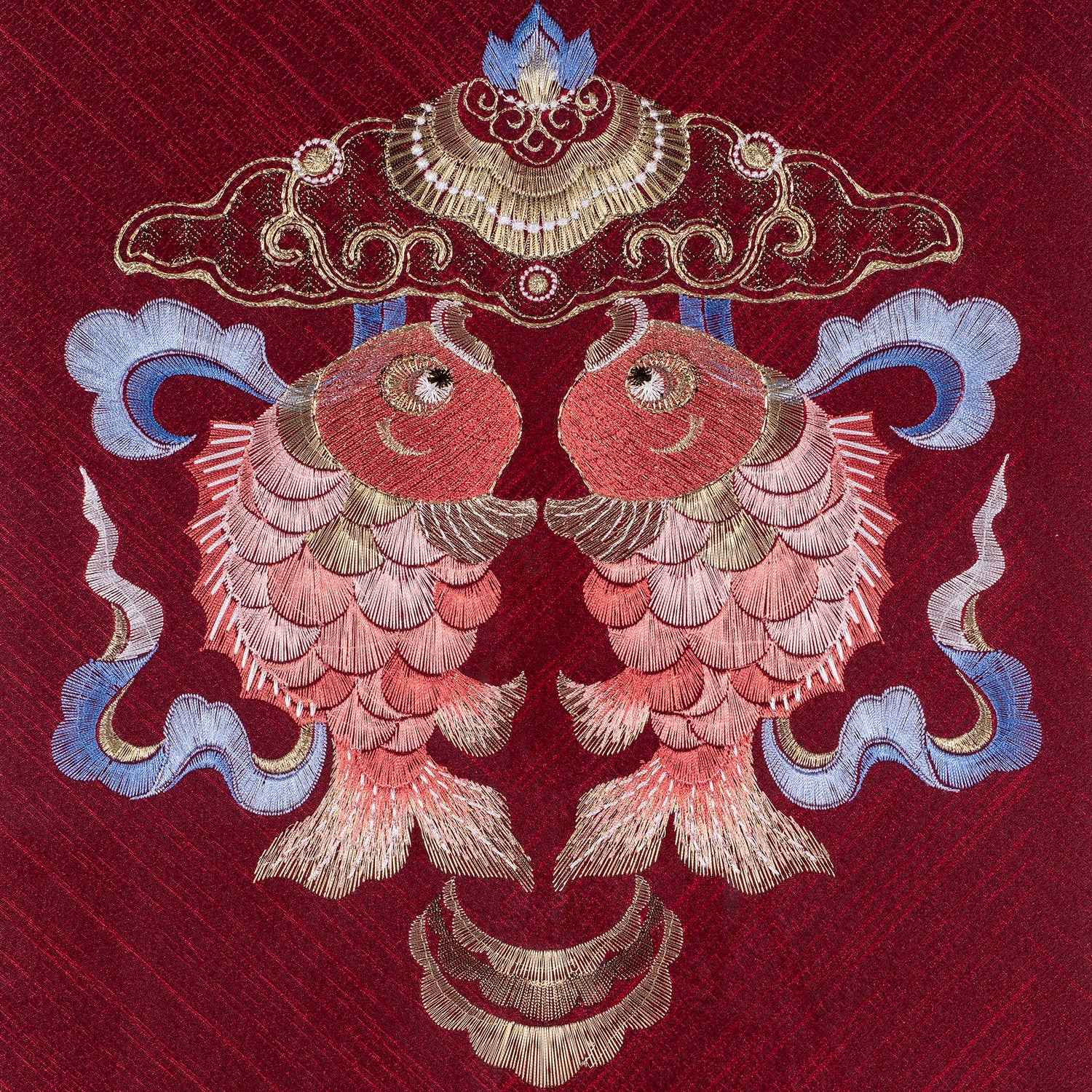 An embroidered work of art with two koi carp