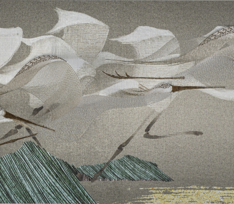 Close- up detail of embroidery egrets design.