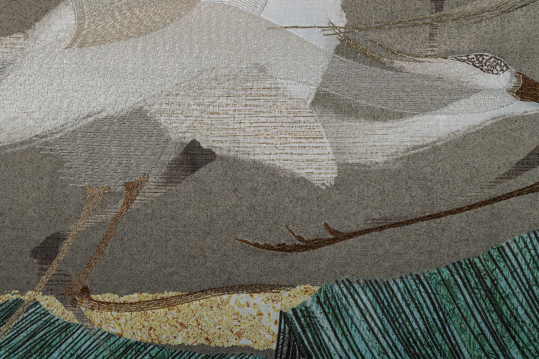 Close-up view of framed embroidery artwork featuring detailed stitching of an egret in the flock of egrets design.