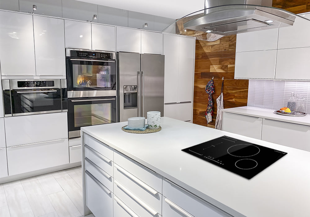 There is a sleek black glass-ceramic 30" induction cooktop on the modern kitchen's counter.