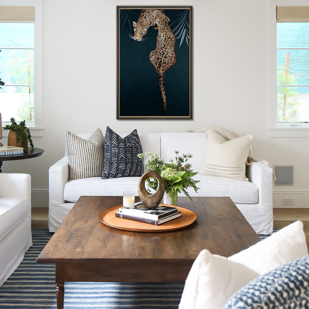 Framed Embroidery Fine Wall Art of Leopard Design hanging over a white sofa in an elegant living room with solid-wood table.
