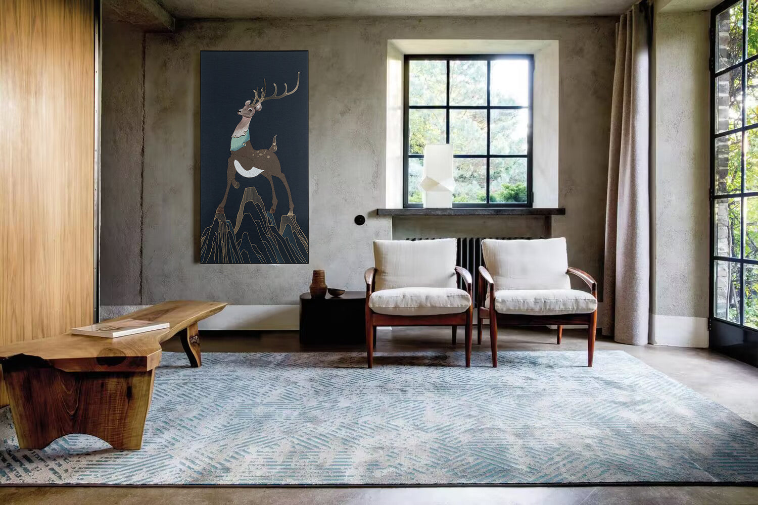 Framed embroidery fine wall art of a sika deer design displayed in a rustic living room with earthy tones and natural light.