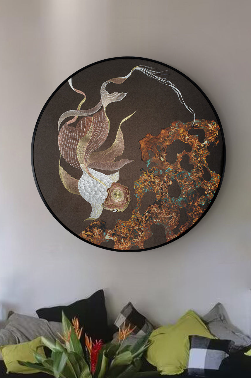 A piece of embroidered art with carp hangs on the wall of the Scandinavian-style living room, looking very clean with the minimalist home.