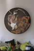 A piece of embroidered art with carp hangs on the wall of the Scandinavian-style living room, looking very clean with the minimalist home.