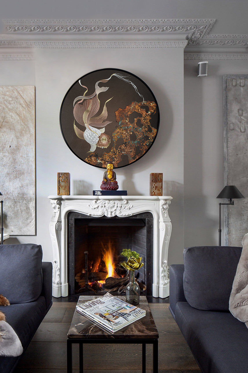 Over the elegant living room fireplace hangs an embroidery work with a koi fish.