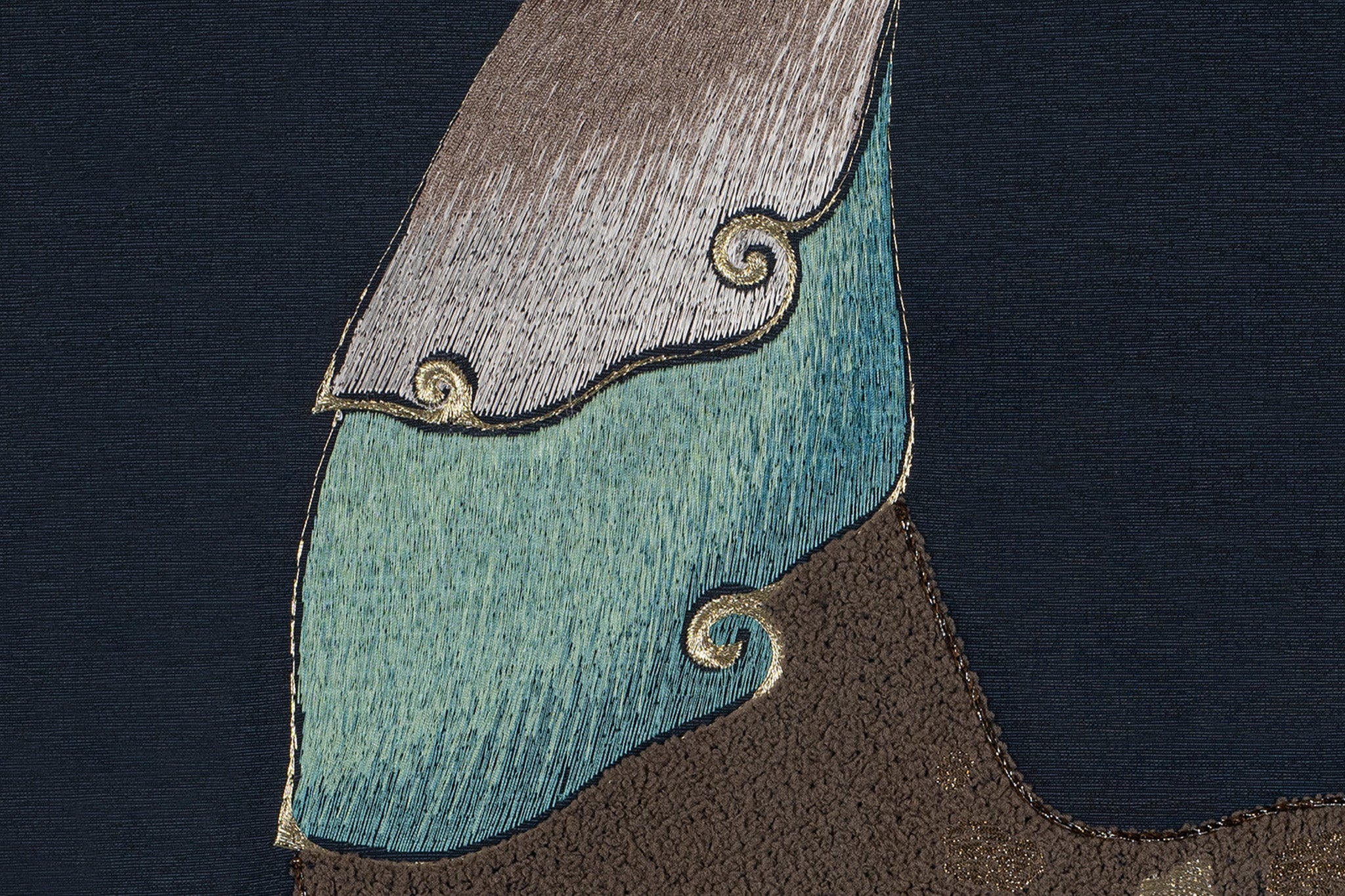 An embroidery artwork showcasing the intricate details of the deer's neck ornaments.