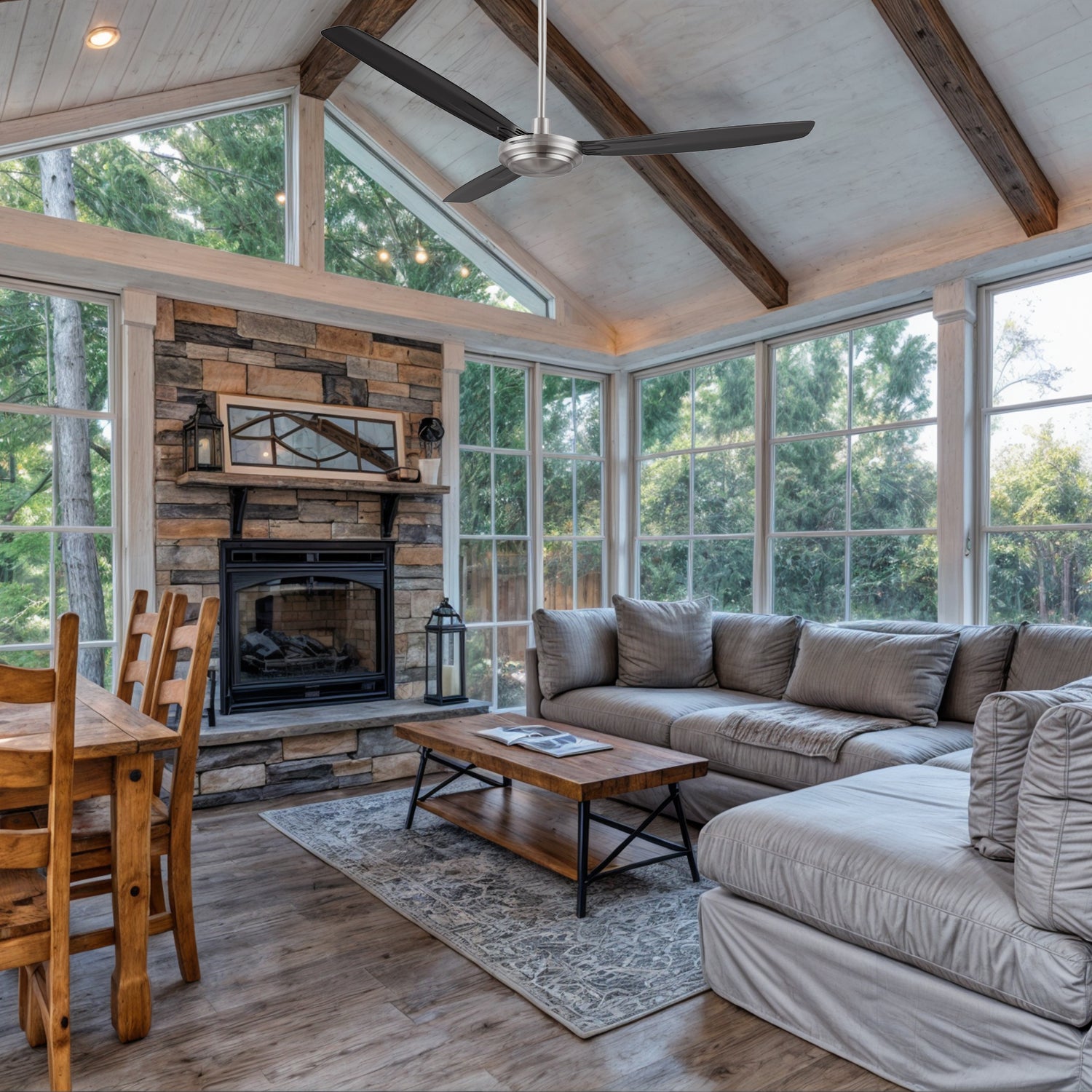 Kade 56-inch brushed nickel ceiling fan with remote control, installed in a farmhouse style living space. Black and silver design adds a rustic touch.