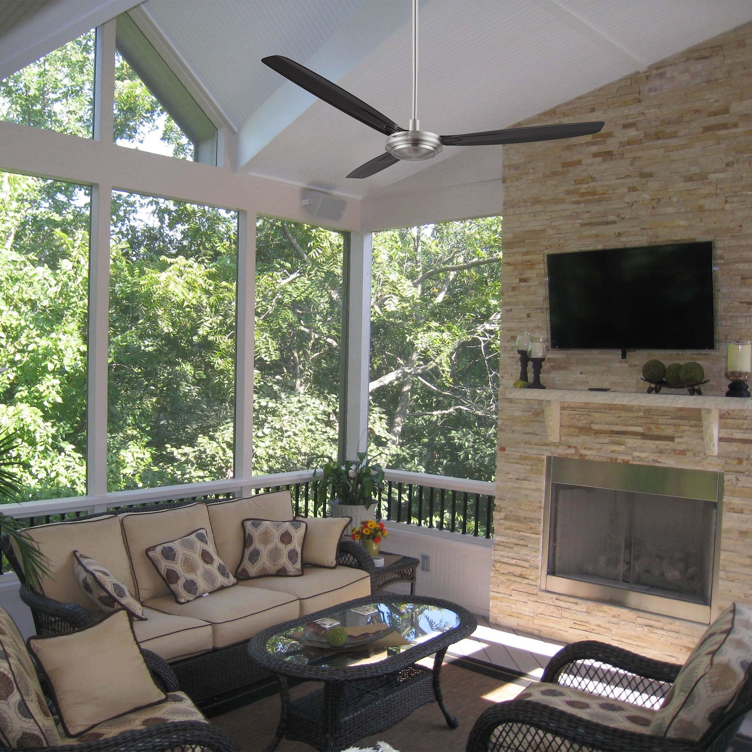 Kade 56-inch brushed nickel ceiling fan with remote control, installed in a modern living room. Black blades contrast with silver finish for a sleek look.