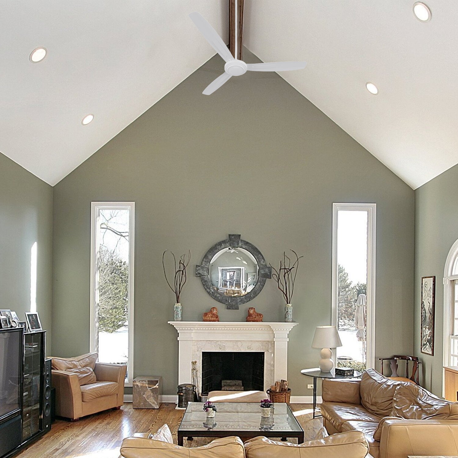 Kade 56-inch white ceiling fan with remote control, cooling a modern living room with high ceilings. White finish adds a clean, minimalistic touch.