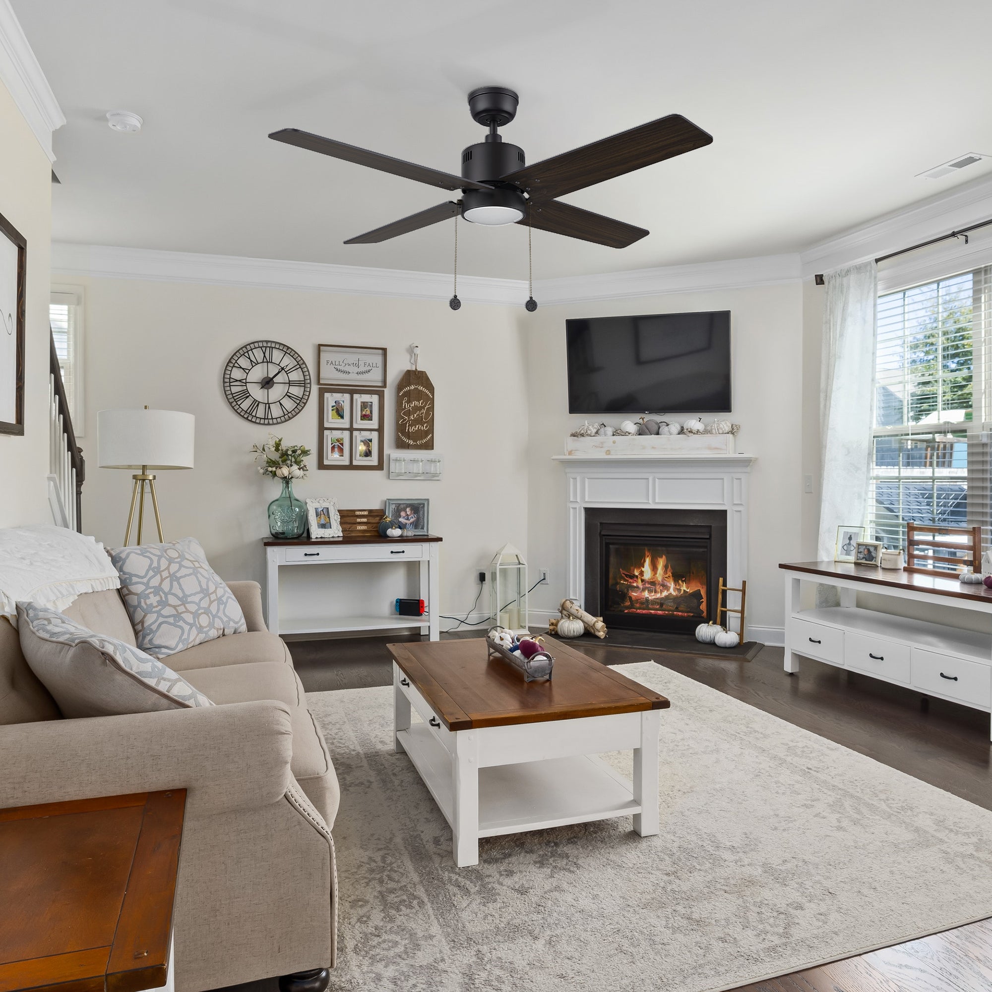 Carro Smafan Rowan 52 inch modern ceiling fan with LED light in a black finish, displayed in a living room setting.