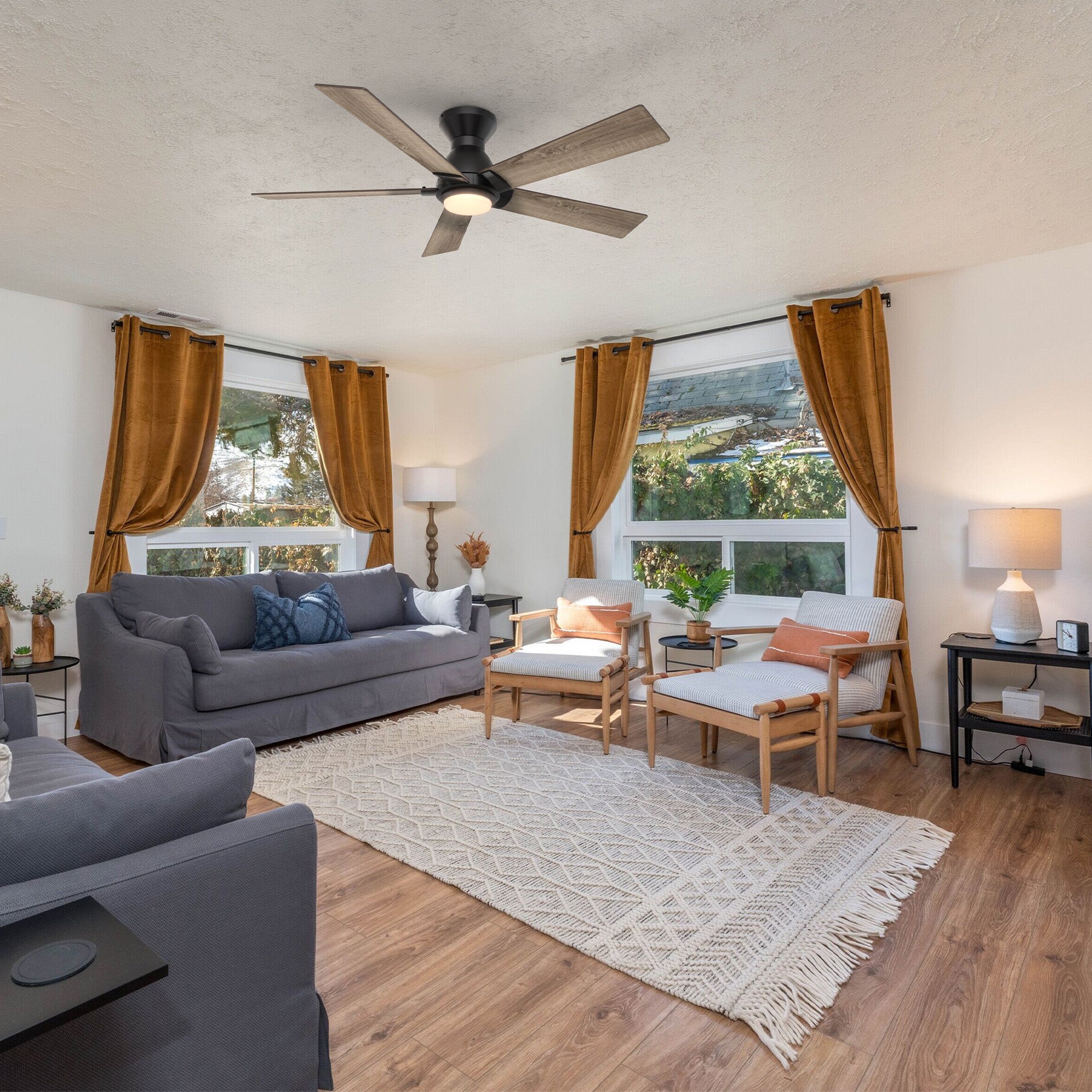 Carro Armoy 52 inch low profile remote control ceiling fan with light, 5 blades, light wood design, installed in living room.