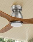 Carro Oswego 52 inch outdoor ceiling fan with LED light, and 3 solid wood fan blades, flush mounted in indoor/outdoor living space.