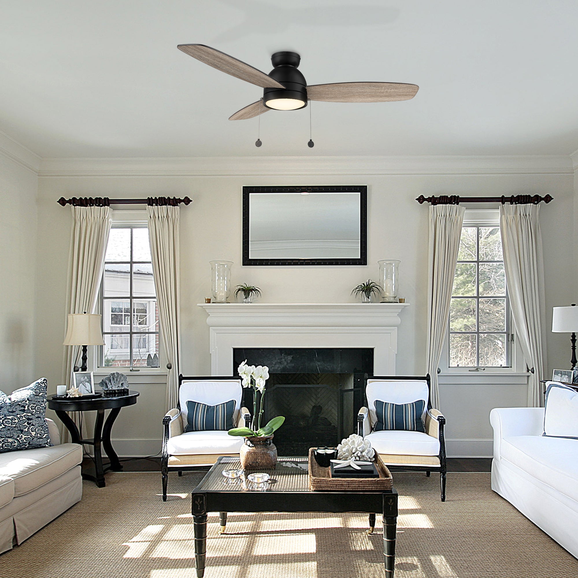 Carro Troyes 52 inch pull chain ceiling fan, light wood design, and an integrated 4000K LED cool light, low profile, decor in a livingrom.