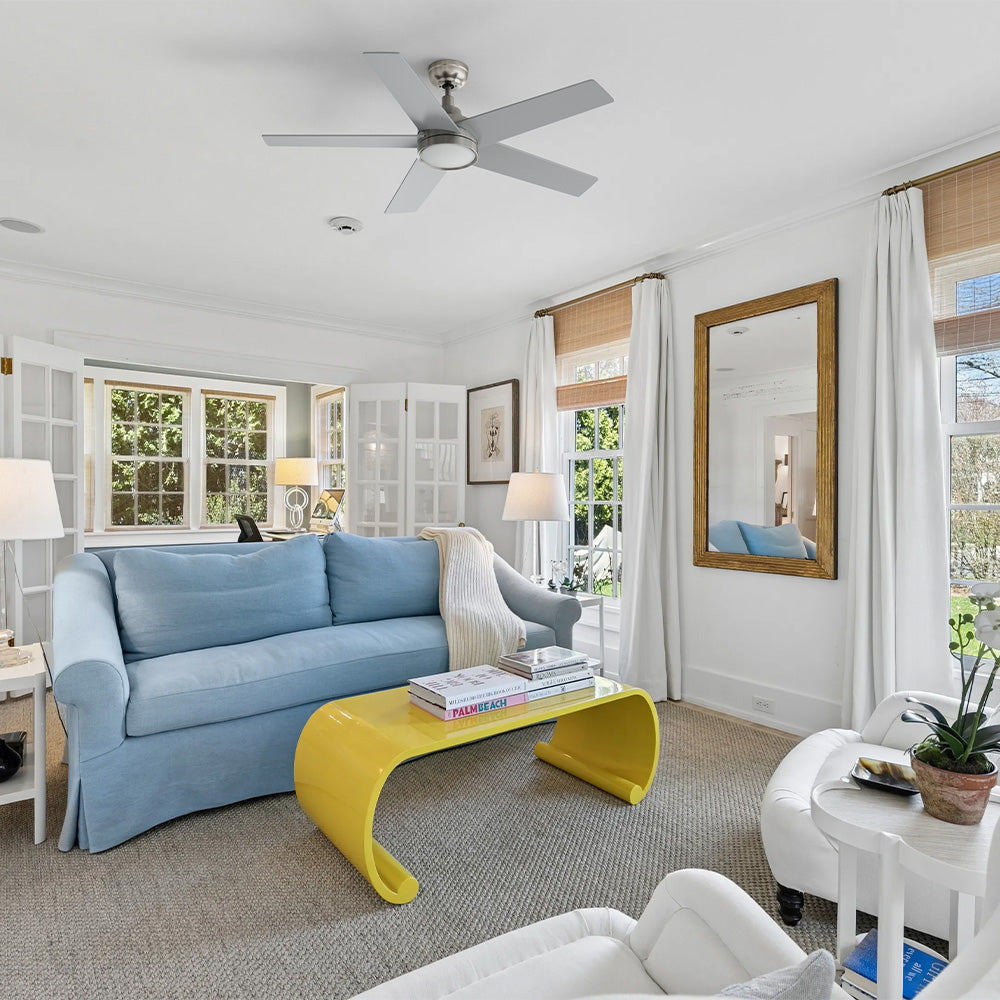 Smafan Albi transitional ceiling fan with light featuring a 52 inch brushed nickel finish and 5 silver blades, installed in a bright living room with a blue sofa. #color_silver