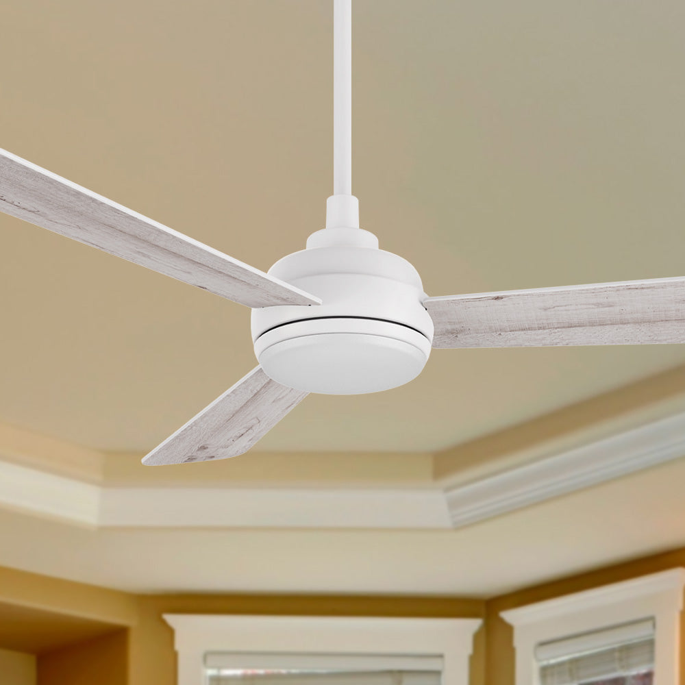 A Smafan Audra 52-inch ceiling fan with an integrated LED light, featuring a white motor and downrod, and three reversible blades with a light wood grain finish, is installed on a cream-colored ceiling with decorative white crown molding and trim visible in the background.