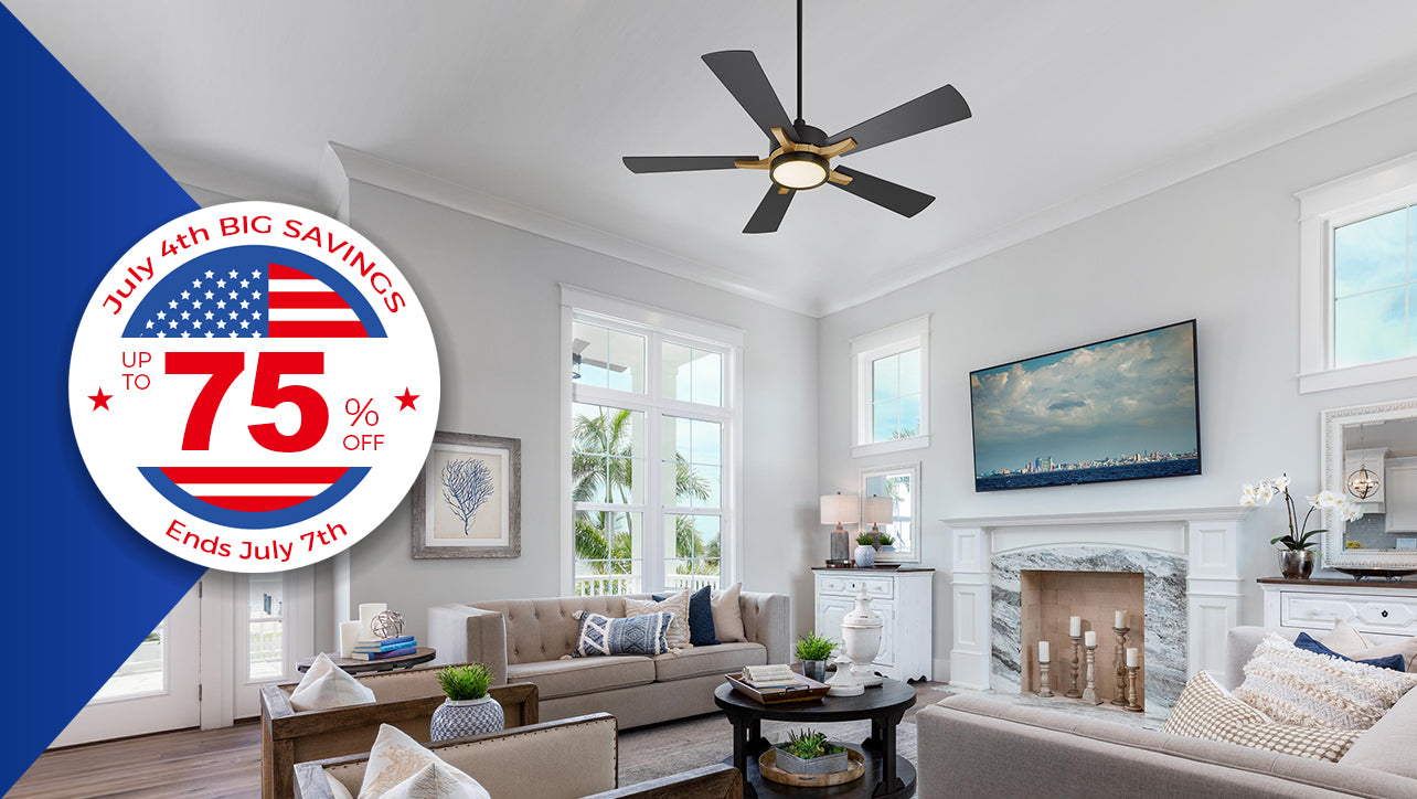Living room promotional banner with a blue section on the left and a modern living room on the right. The room features gray walls, large windows, a brown sofa, and a black coffee table, with a city skyline painting on the wall and candles on the fireplace. A black five-blade ceiling fan with a light hangs from the ceiling. A circular white badge on the left with an American flag design has red text reading “July 4th BIG SAVINGS UP TO 75% OFF Ends July 4th”.