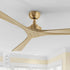 Smafan Thora 60 inch wood ceiling fan with remote in a gold finish, featuring three light wood blades and a brass-colored base, mounted on a white ceiling with the white remote control shown in the corner.