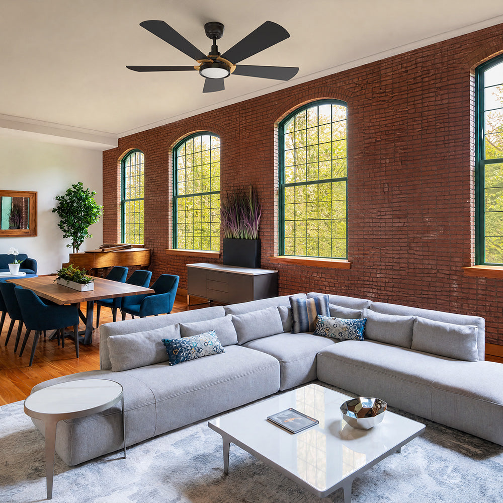 Large five-blade black ceiling fan in an industrial loft living room