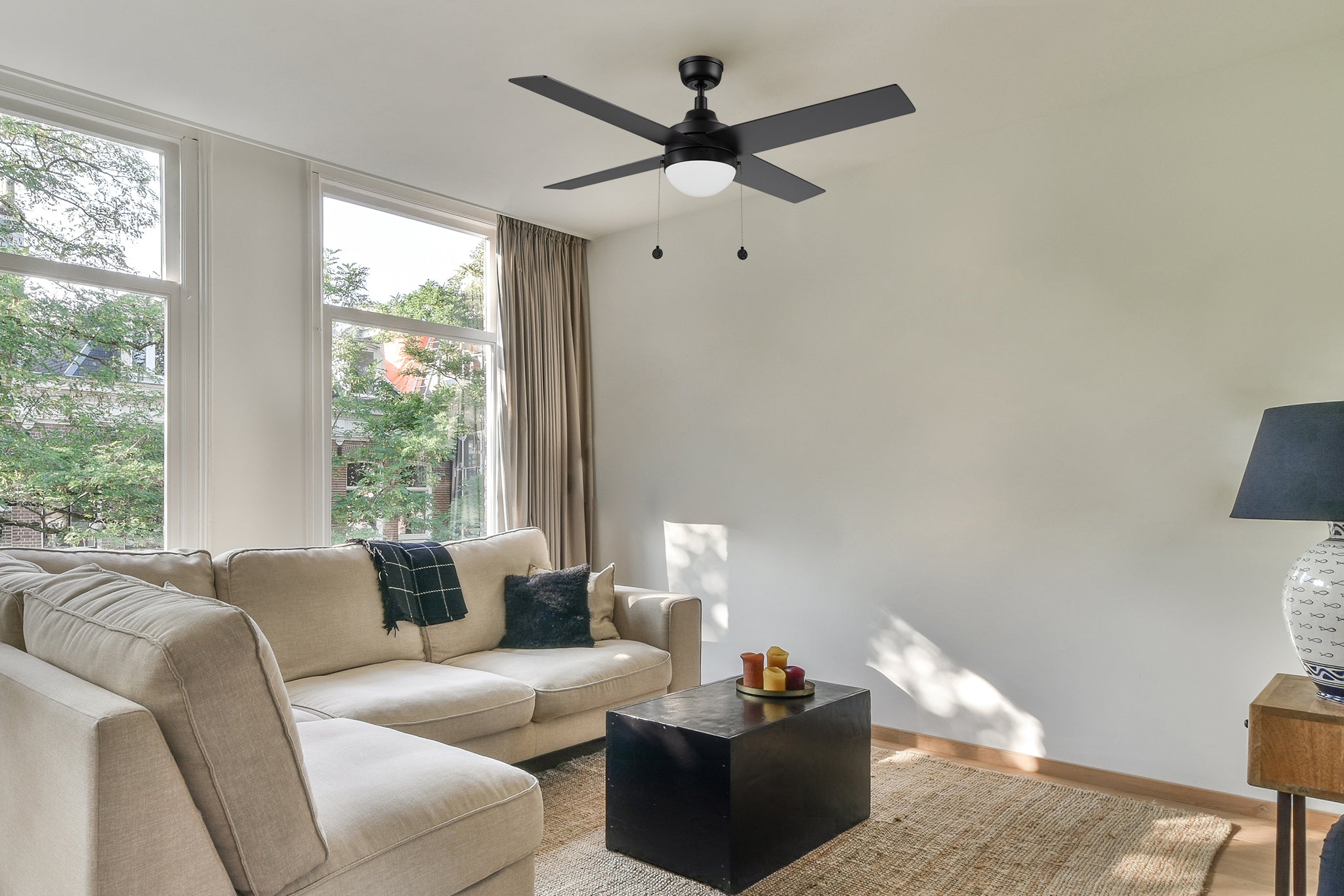 With four blades, Sunalia black modern ceiling fan with dimmable LED light and pull chain.