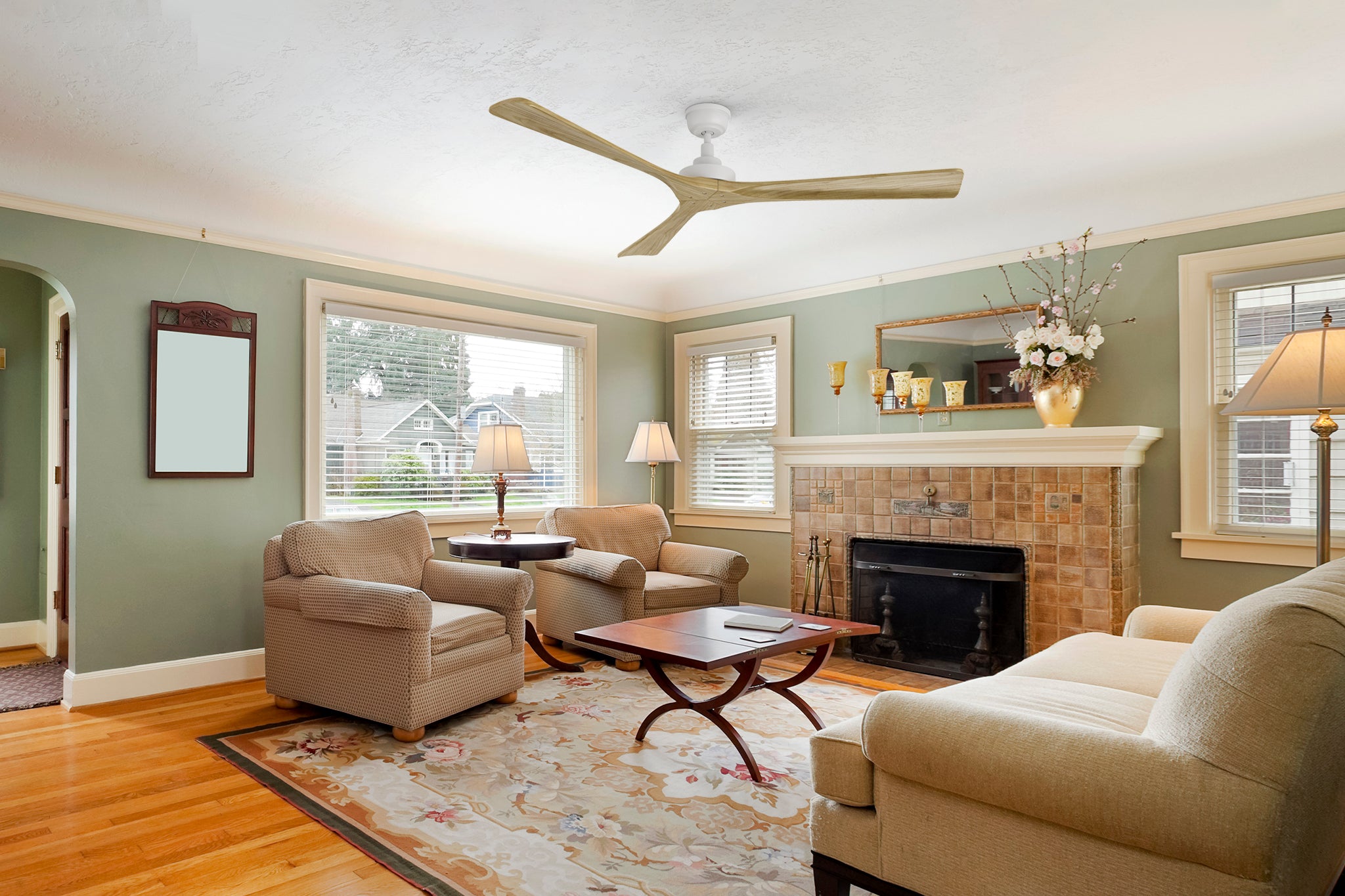 Thora farmhouse ceiling fan installed in a traditional living room. The white motor and natural wood blades enhance classic aesthetics while ensuring quiet, energy-efficient airflow.