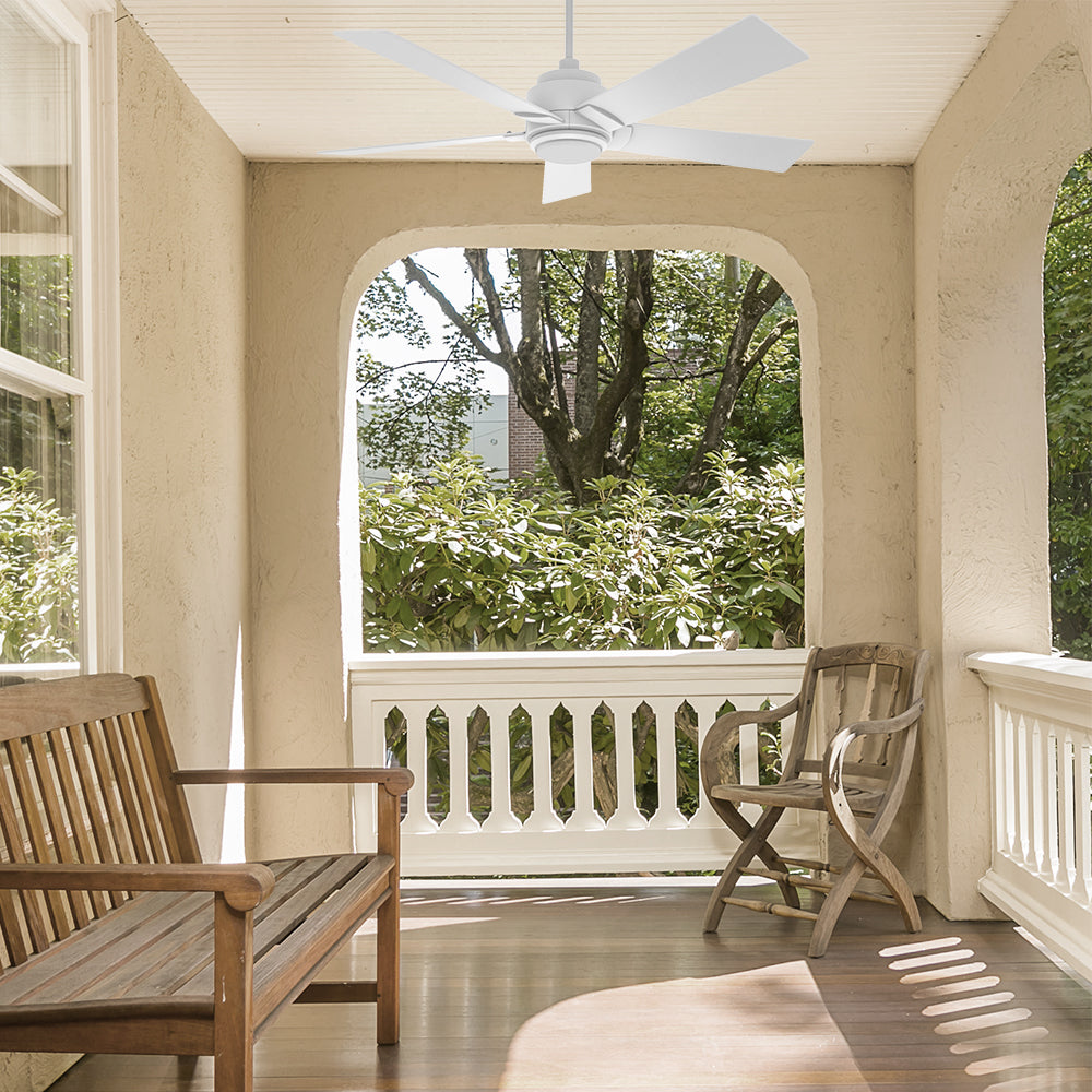 60 inch Aspen Smart Ceiling Fan in white with LED Light installed on a cozy porch with wooden furniture, featuring a beautiful view of lush greenery.
