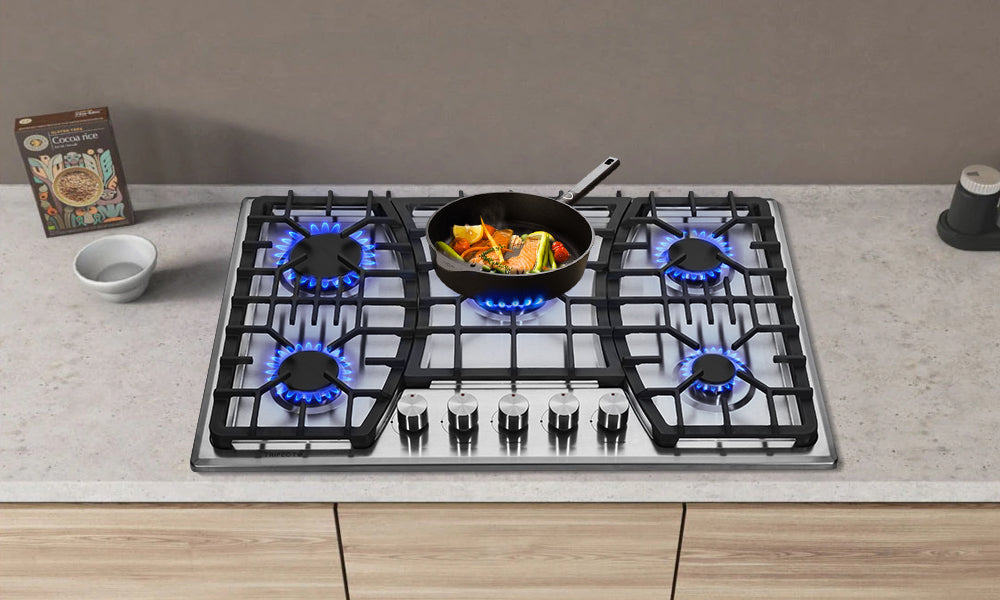 A gas cooktop with high-power heating for frying food  on elegant white marble kitchen countertop