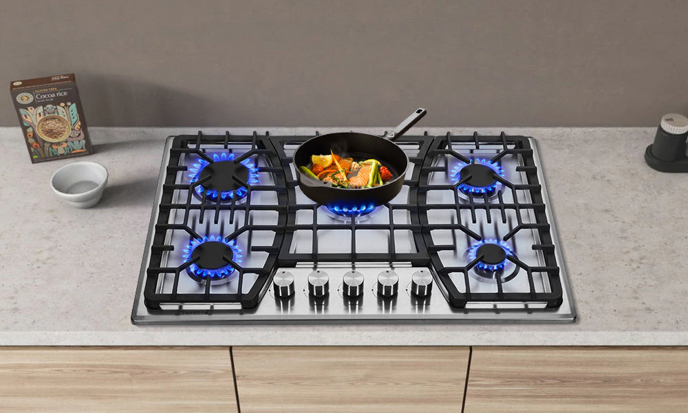 A gas cooktop with high-power heating for frying food on elegant white marble kitchen countertop