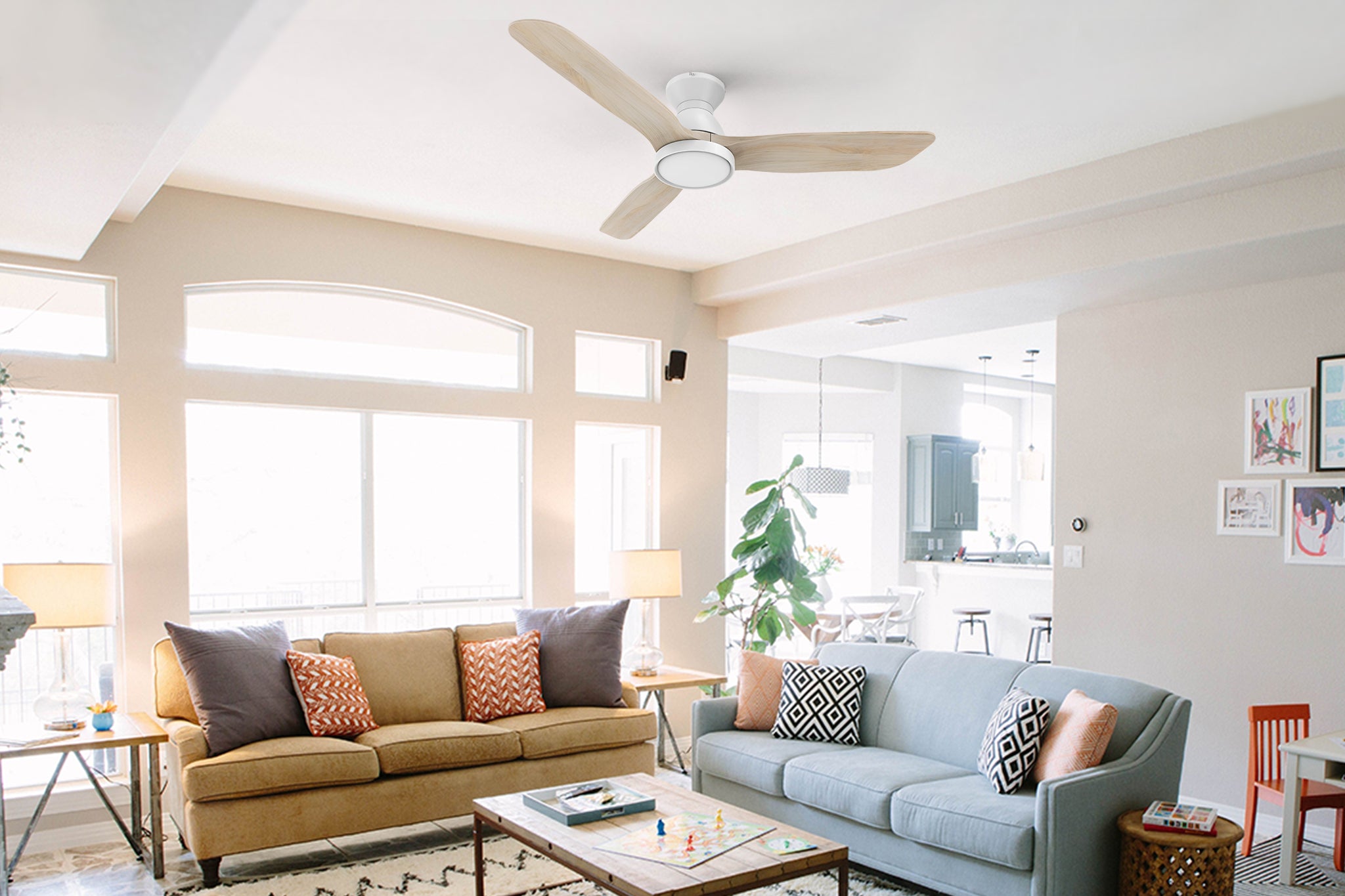 Low-profile ceiling fan with dimmable LED light and remote in living room, matching with modern brown sofa and blue sofa, white lampshade, transparent glass lamp, making the interior more modern design.