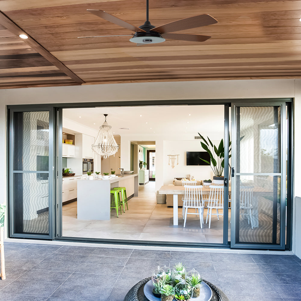Smafan Striker 56 inch outdoor ceiling fan with find wood fan blades design, and an 6/12 in extended rod, mounting in a outdoor patio.