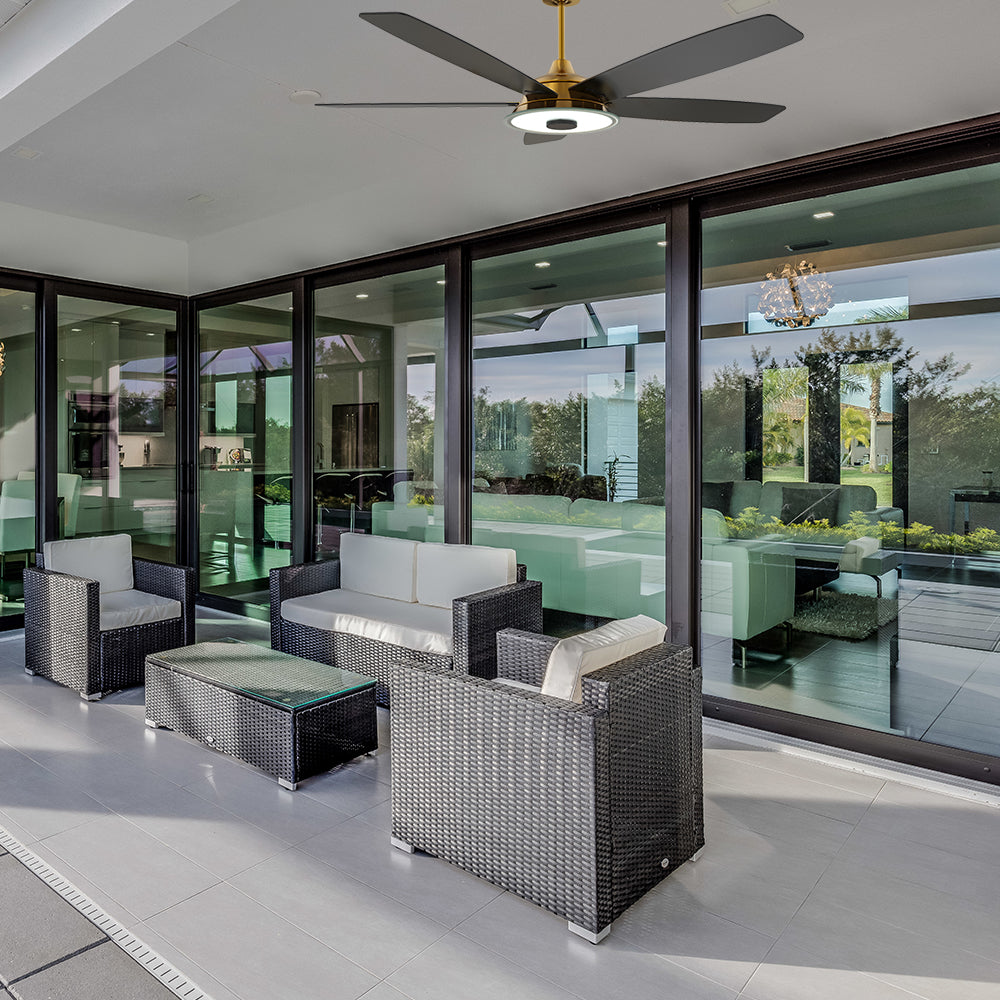 Carro Striker 52 inch outdoor ceiling fan with black and gold design, installed in outdoor patio.