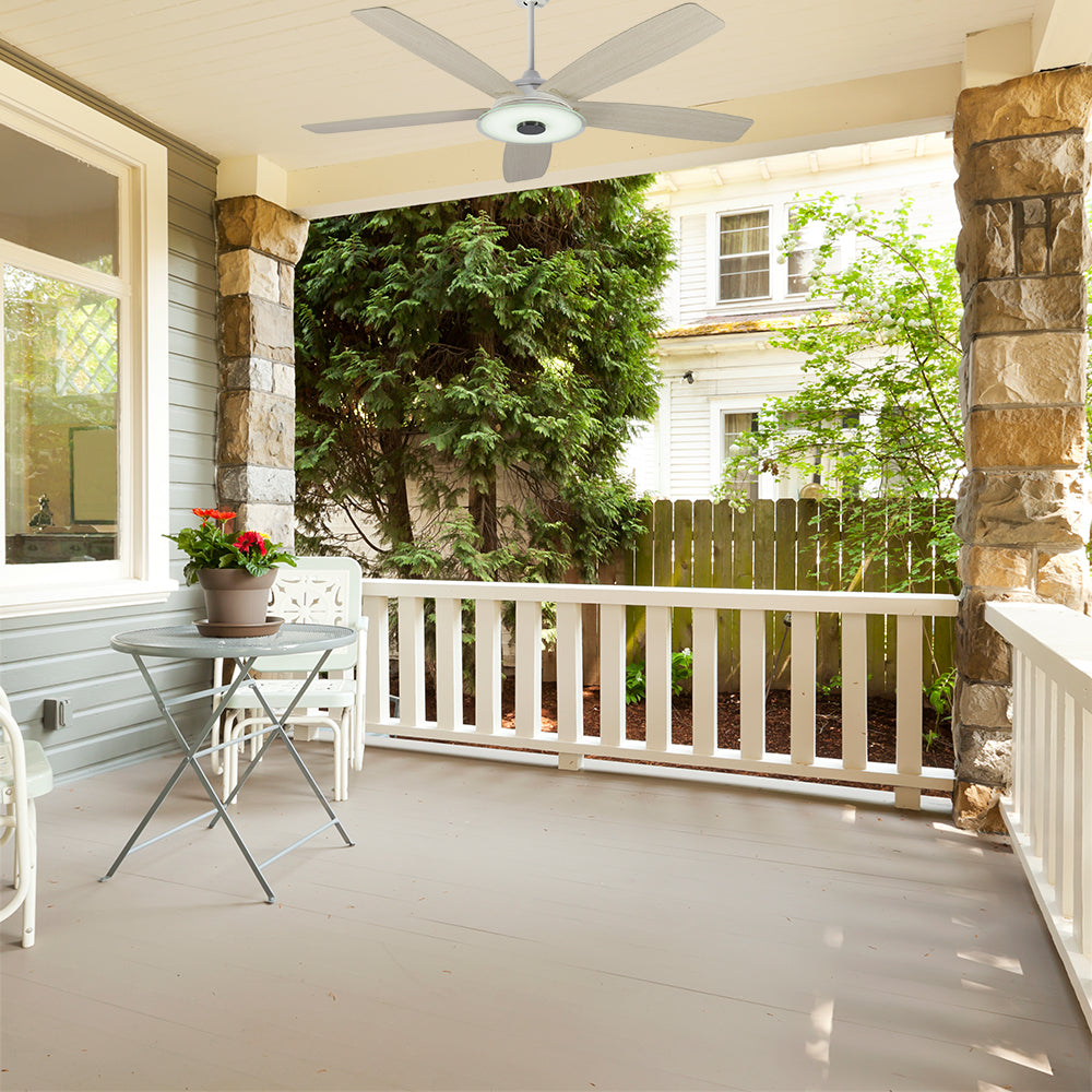 Carro Striker 52 inch outdoor ceiling fan with 5 light wood fan blades design, installed in outdoor garden.