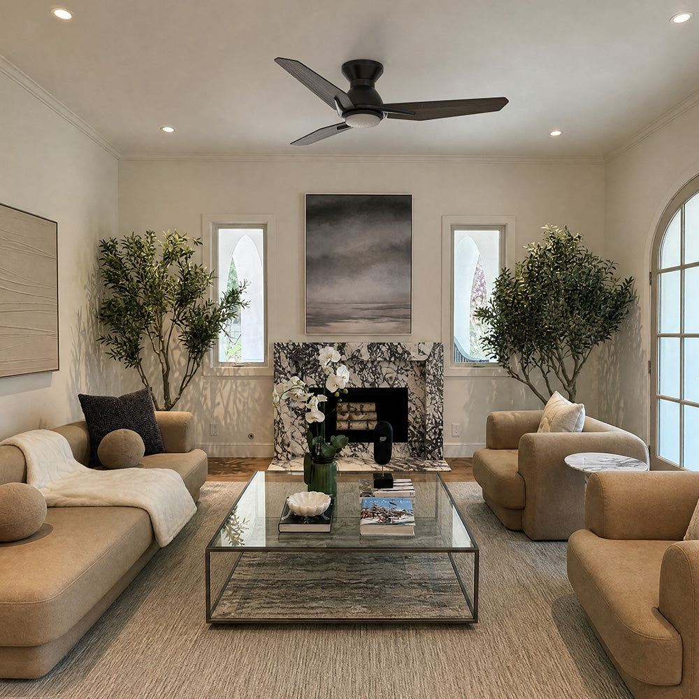 Smafan Brooks 48 inch flush mount ceiling fan with LED light in matte black, installed in a modern living room. The three-blade ceiling fan complements the neutral interior with a marble fireplace, contemporary furniture, indoor trees, and a minimalist design, providing stylish and efficient airflow for medium-sized living spaces.