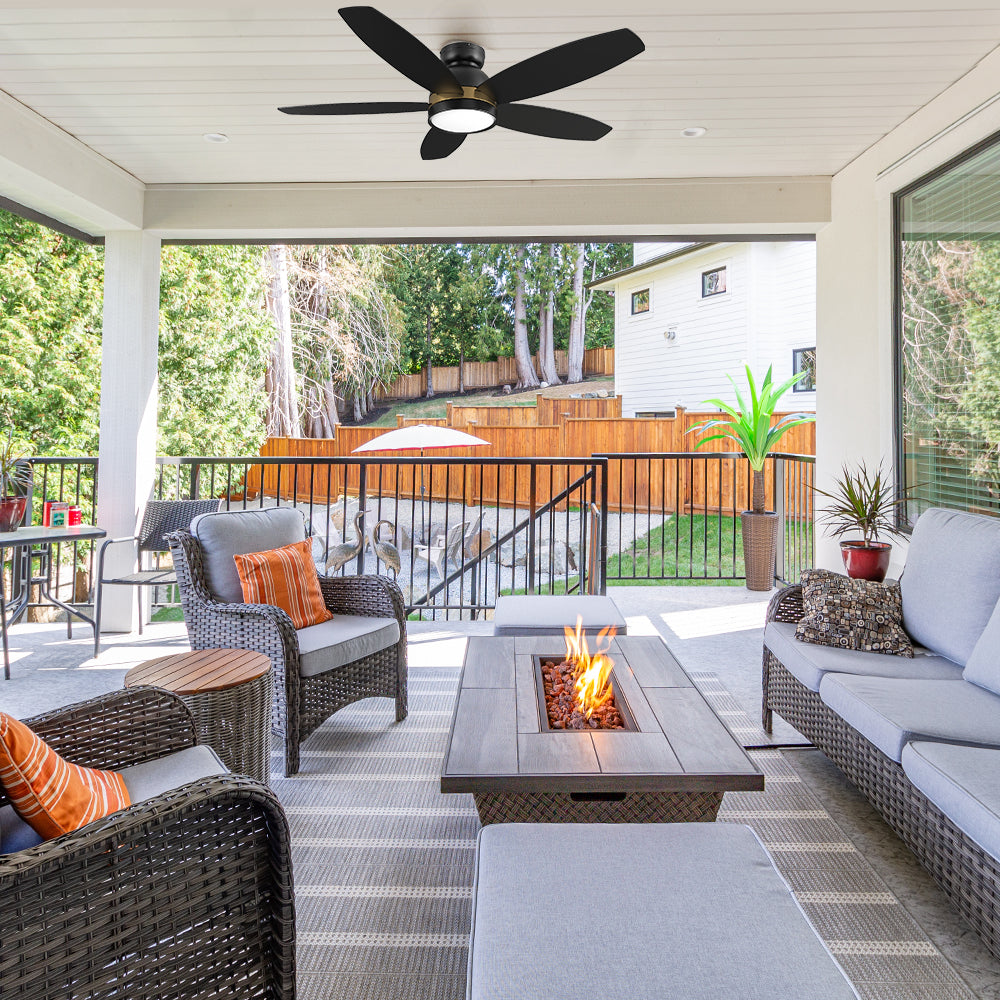 Smafan Carro Levi 48 inch outdoor ceiling Fan with light kit, black and gold design, flush mount, installed in a house balcony.