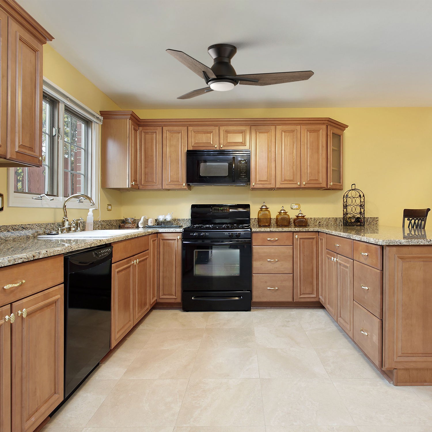44 inch black low profile small size ceiling fan with led light and remote in modern kitchen.
