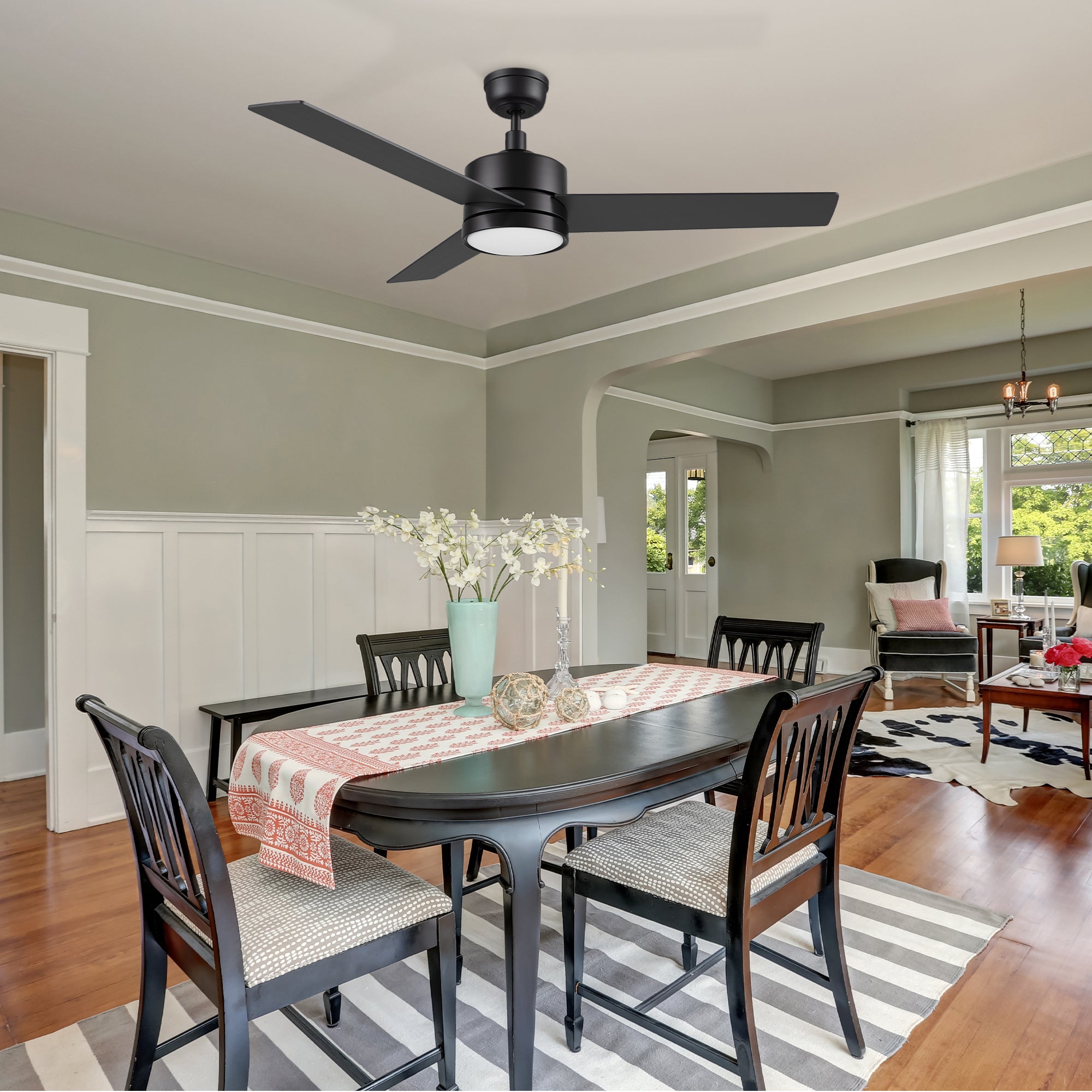 52 inch downrod ceiling fan with LED lights well matches to the black table in modern kitchen. 