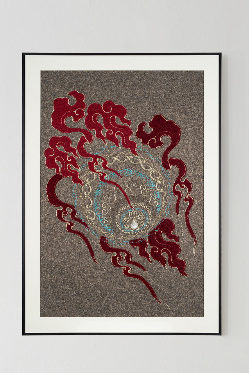 Framed embroidery artwork featuring a lion ball play design with intricate ball patterns. 