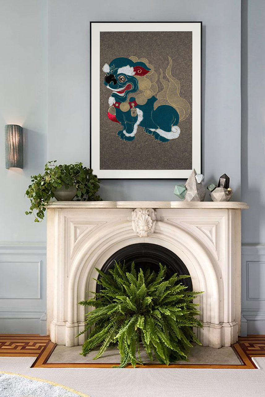 Living room with a fireplace, showcasing framed embroidery artwork featuring a lion ball play design on the right side. 