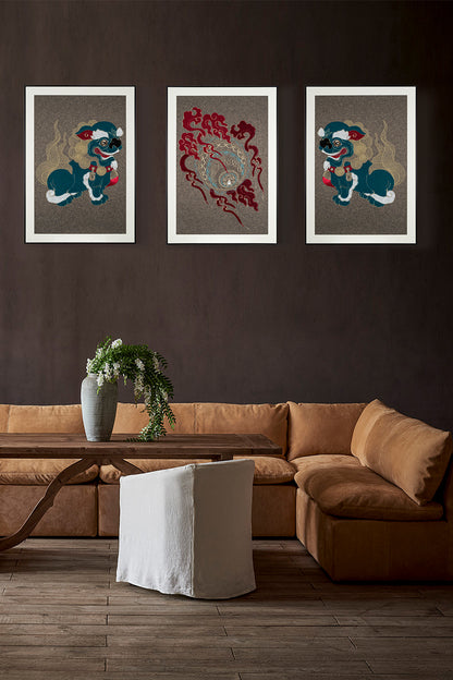 Framed embroidery artwork featuring a lion ball play design displayed on the right side over a sofa table. 